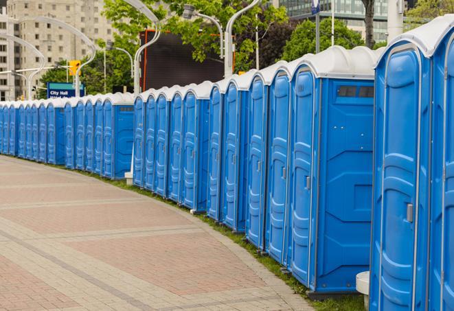 a line of portable restrooms at a sporting event, providing athletes and spectators with clean and accessible facilities in Atlanta GA